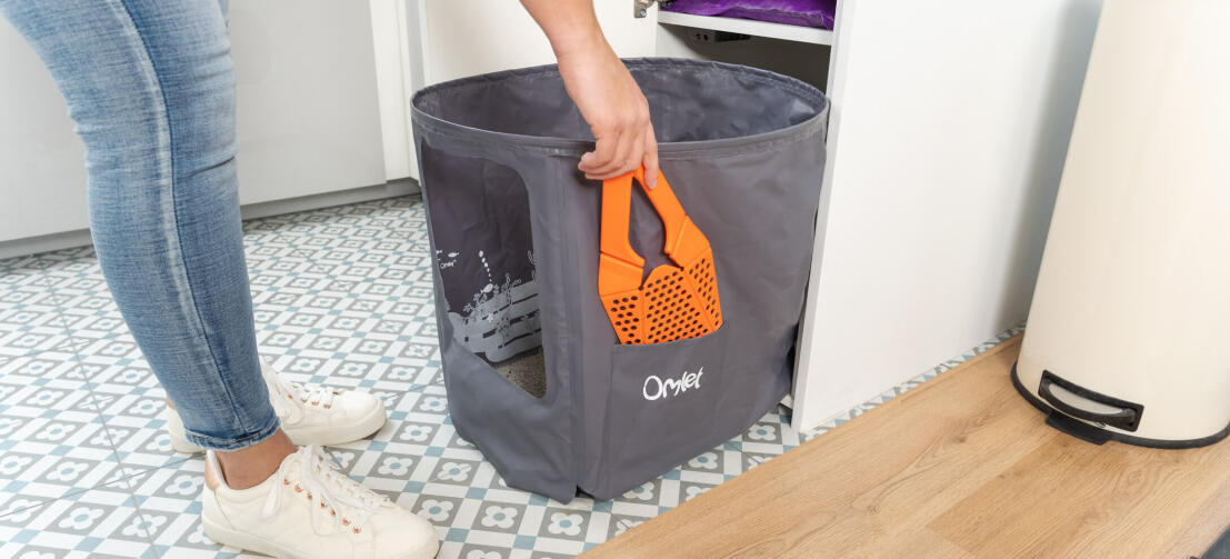 Pulling litter liner out of Maya cat litter box furniture