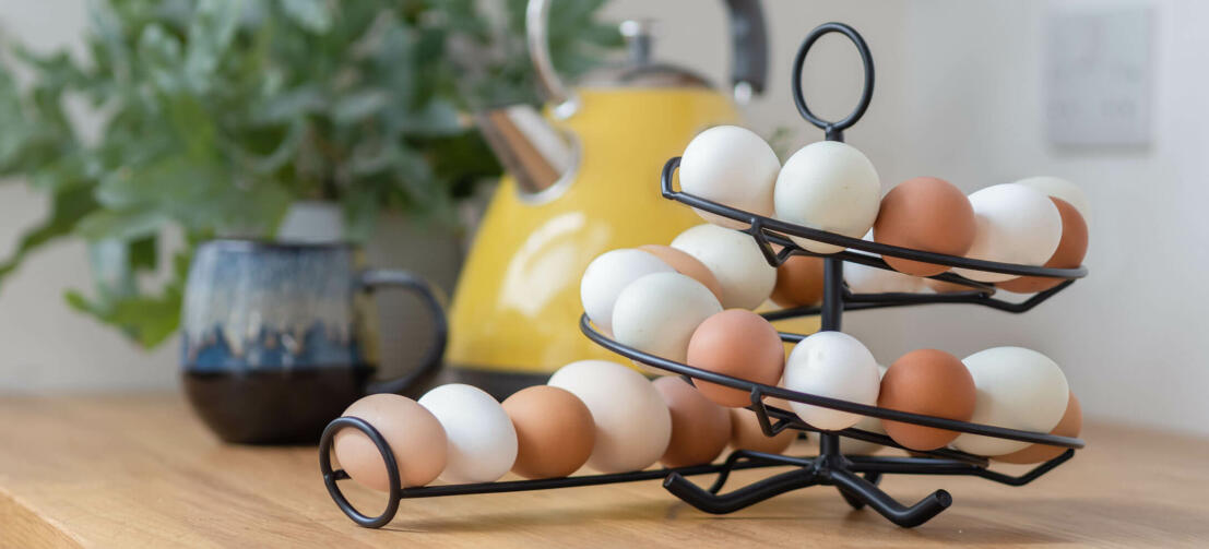 An Omlet egg skelter full of fresh eggs in a kitchen An Omlet egg skelter full of fresh eggs in a kitchen