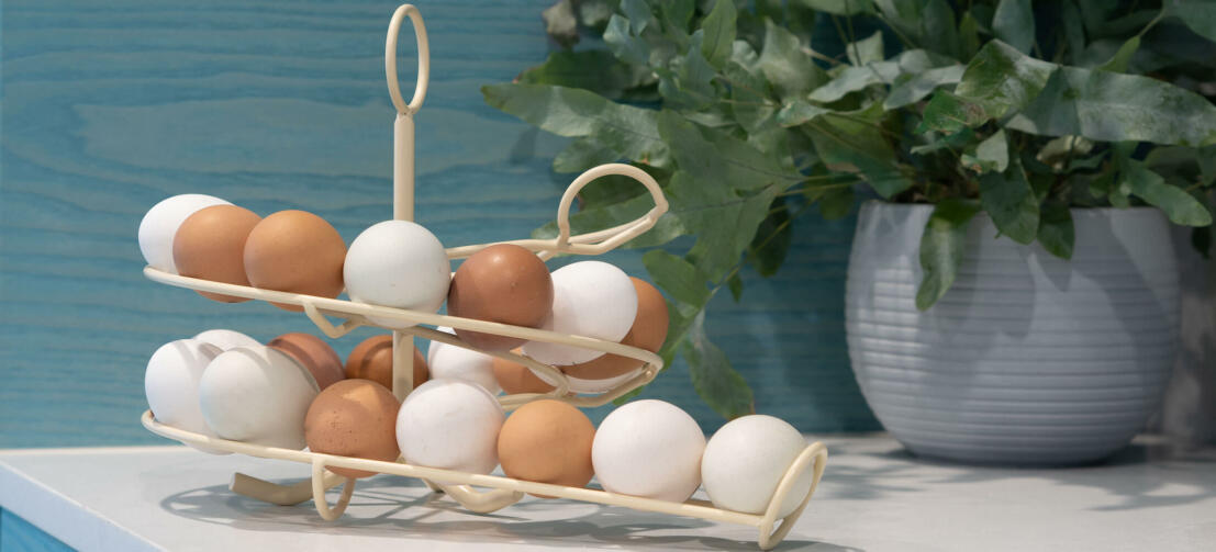 A cream Omlet egg skelter full of fresh eggs in a kitchen A cream Omlet egg skelter full of fresh eggs in a kitchen