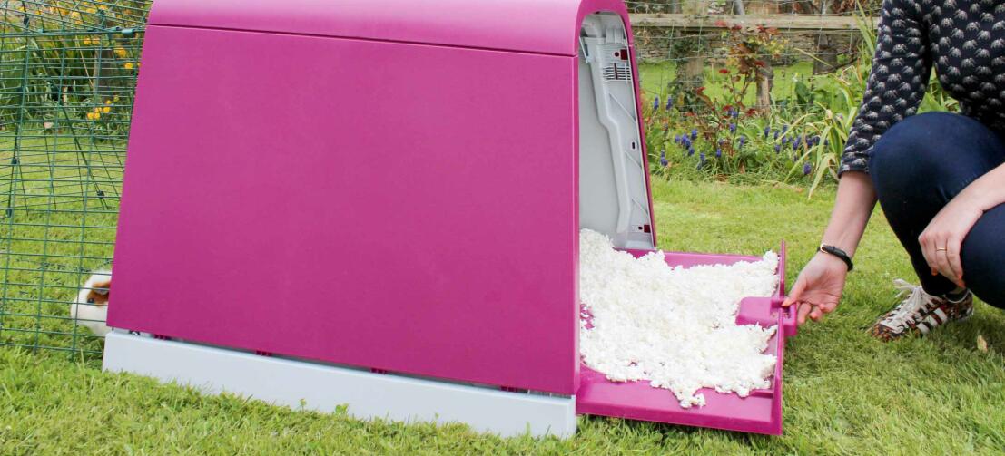 Woman cleaning the Eglu Go hutch Woman cleaning the Eglu Go hutch