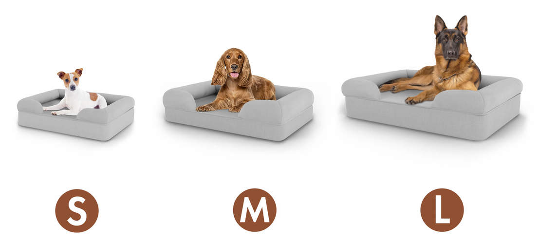 Small, Medium and Large Omlet bolster dog beds with a dog in each size bed Small, Medium and Large Omlet bolster dog beds with a dog in each size bed