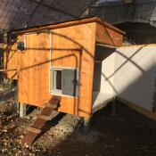 Wooden chicken coop with Omlet grey automatic chicken coop door