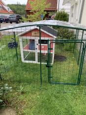 Wooden chicken coop inside Omlet walk in chicken run
