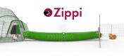 Guinea pigs running down a green Zippi tunnel between a green Go and an animal run