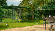 Outdoor cat run in a garden connected with cat walkways