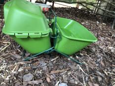 A feeder and drinker attached together using the feeder and drinker stand.