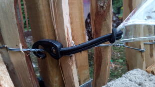 A bungee cord holding on a shade down.