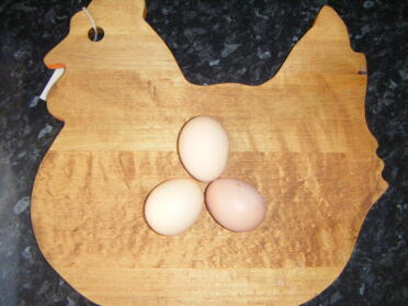 My big girl eggs on my chicken chopping board