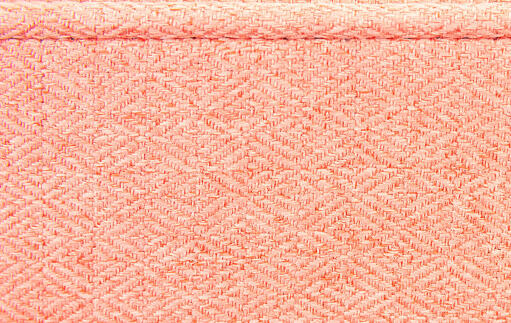 A pink fabric swatch for a bolster bed