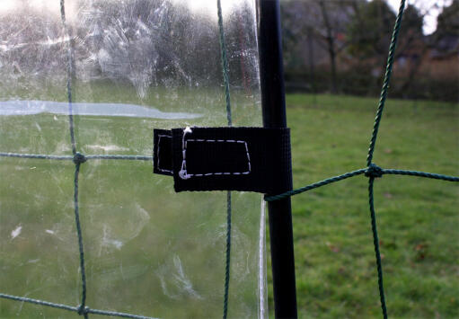 Velcro fastening attaches windbreak to fencing pole