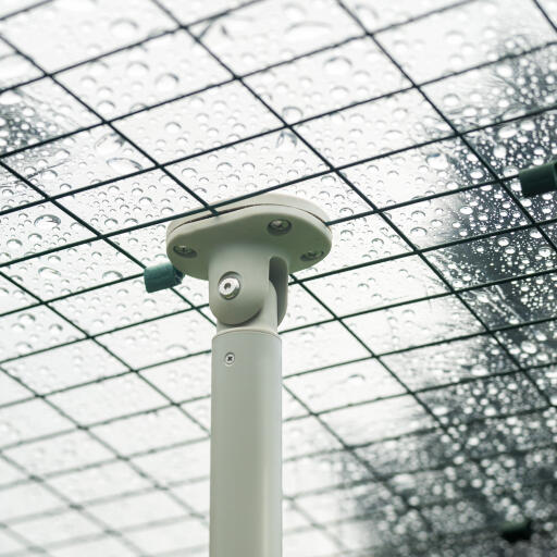 Detail of vertical pole in walk in run with clear weather protection cover