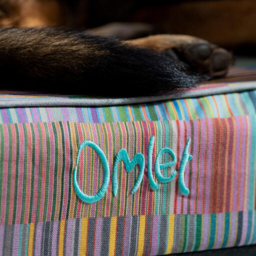 A close up of the pawsteps electric bolster dog bed
