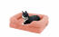Cat laying in peach pink bolster bed for cats
