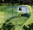 Green Eglu Cube chicken coop with run and clear cover in the garden