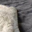 The blanket is dual-sided with a stylish quilted grey on one side and a luxury, cream sherpa on the reverse.