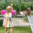 Inside Omlet Zippi rabbit playpen with Zippi platforms, Zippi play tunnel, girl and rabbit