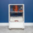 Modern white Qute Hamster and Gerbil cage in a living room.