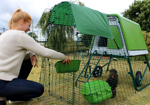 The green Eglu Go Up chicken coop looks great in the garden and chickens love it